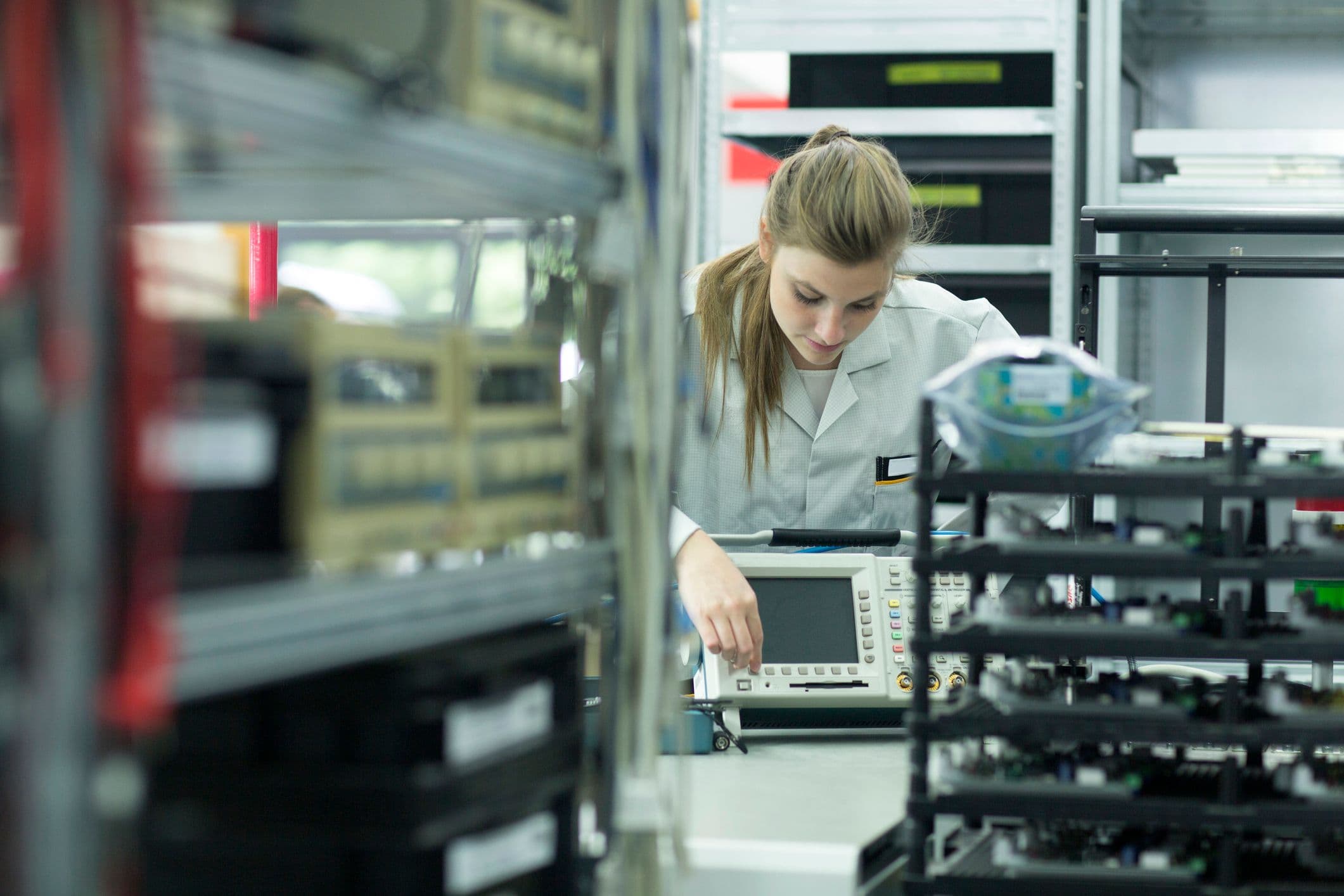 Technician inspecting ruggedized prototype hardware
